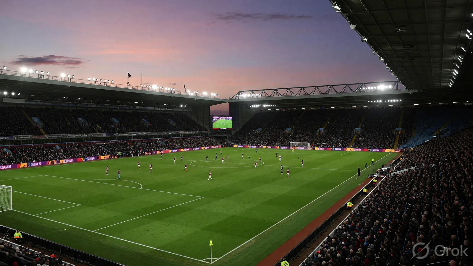 Wide view of a Premier League football stadium at evening kick-off with the pitch lit and supporters filling the stands